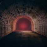 a look into a tunnel with read laser light at the end