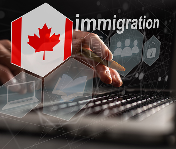 a keyboard in the background and the Canadian flag and the word "immigration" in front of it