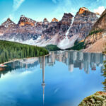a calm Canadian lake with Toronto mirroring on the water