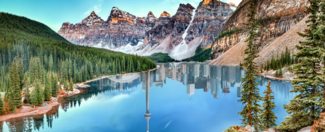 a calm Canadian lake with Toronto mirroring on the water