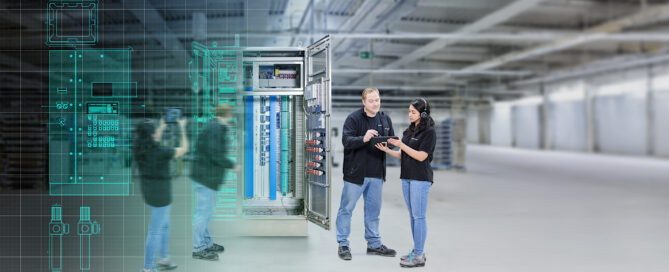 Two people in front of switch cabinet from Pepperl+Fuchs