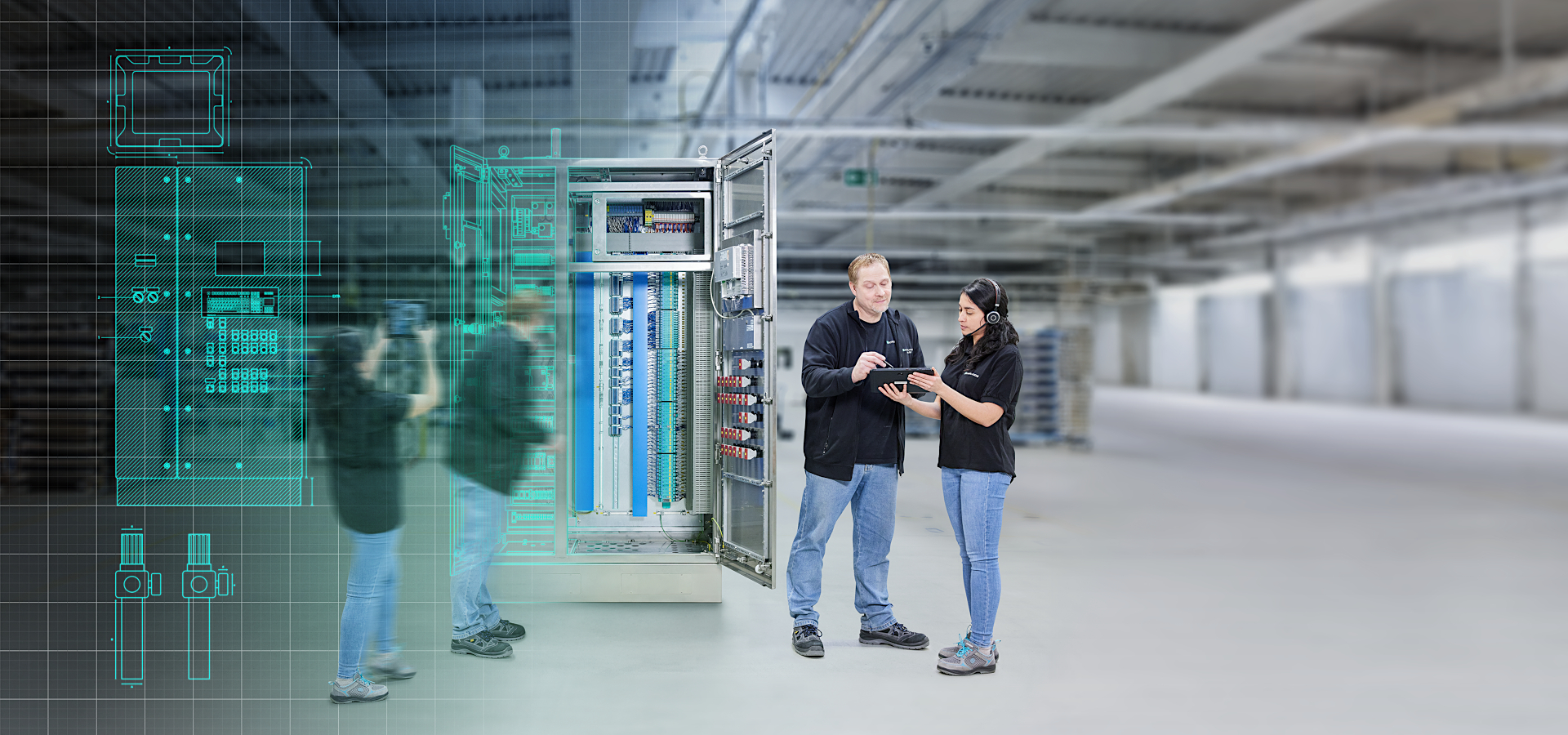 Two people in front of switch cabinet from Pepperl+Fuchs